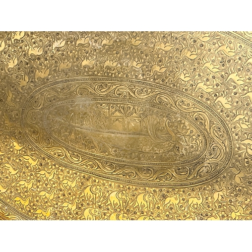 289 - A large Late 19th Century Indian style engraved brass tray. 77x44cm