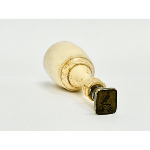 78 - A 19th Century bone wax seal. 8cm