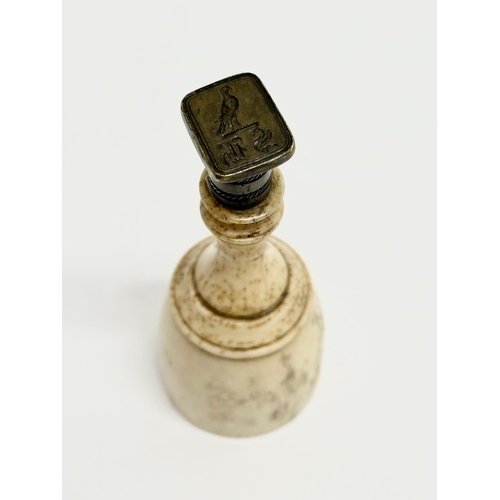 78 - A 19th Century bone wax seal. 8cm