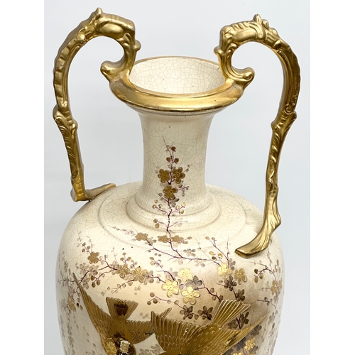 143 - A very large Late 19th Century hand painted gilt and enamel baluster vase, with gilt foliage handles... 