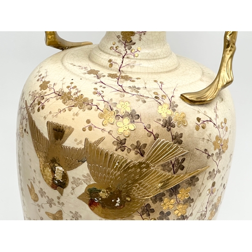 143 - A very large Late 19th Century hand painted gilt and enamel baluster vase, with gilt foliage handles... 