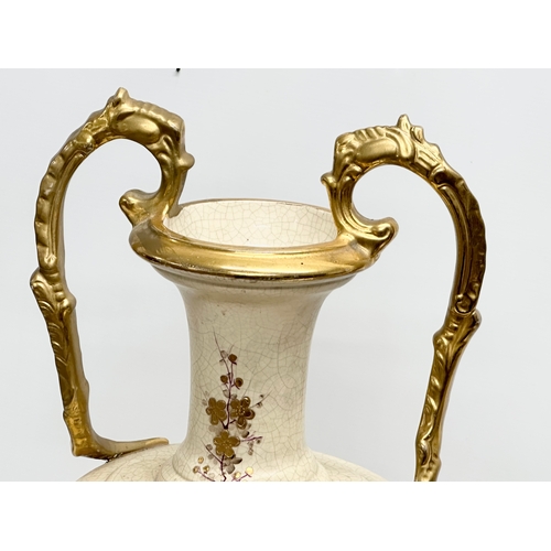 143 - A very large Late 19th Century hand painted gilt and enamel baluster vase, with gilt foliage handles... 