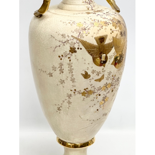 143 - A very large Late 19th Century hand painted gilt and enamel baluster vase, with gilt foliage handles... 