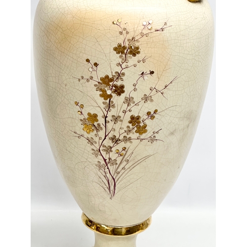 143 - A very large Late 19th Century hand painted gilt and enamel baluster vase, with gilt foliage handles... 