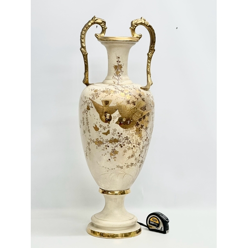 143 - A very large Late 19th Century hand painted gilt and enamel baluster vase, with gilt foliage handles... 