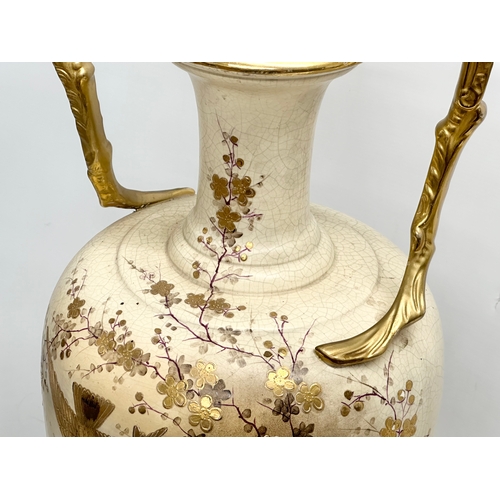 143 - A very large Late 19th Century hand painted gilt and enamel baluster vase, with gilt foliage handles... 