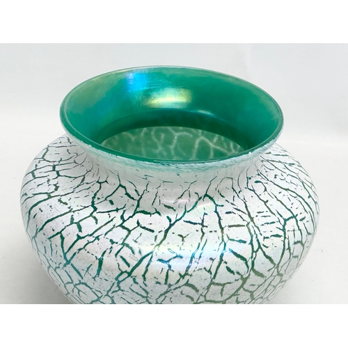 129 - A large Bohemian style iridescent glass bowl. In the manner of Loetz. 23x19cm