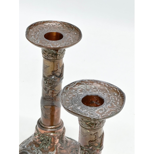 193 - A pair of Late 19th Century Japanese style copper over pewter candlesticks. 9x9x17.5cm.