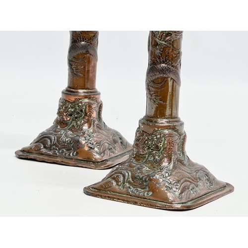 193 - A pair of Late 19th Century Japanese style copper over pewter candlesticks. 9x9x17.5cm.