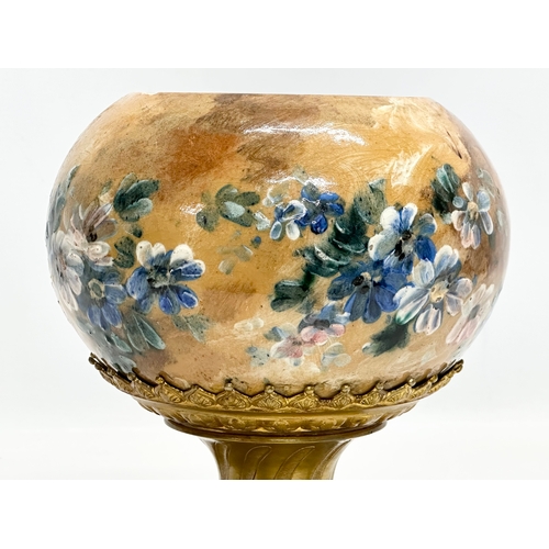 113 - A Late 19th Century French hand painted pottery bowl on a gilt bronze base. 18x18x22cm.