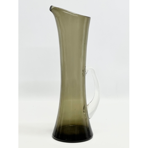 244 - A tall 1960’s Whitefriars smoked glass pitcher. 37cm