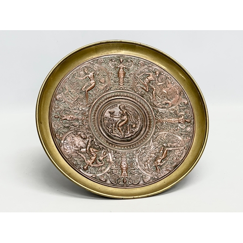 31 - Elkington & Co. A Late 19th Century copper and brass centrepiece tazza, with classical design relief... 