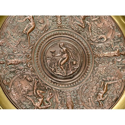 31 - Elkington & Co. A Late 19th Century copper and brass centrepiece tazza, with classical design relief... 