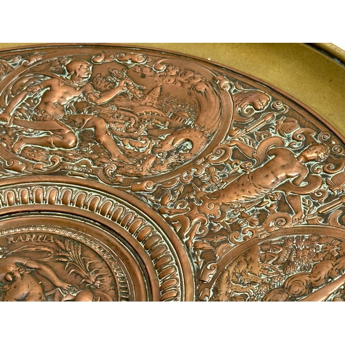 31 - Elkington & Co. A Late 19th Century copper and brass centrepiece tazza, with classical design relief... 