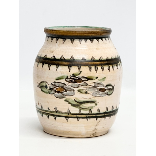 213 - An Early 20th Century glazed ceramic pot. 14x17cm