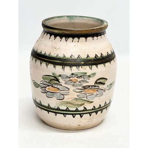 213 - An Early 20th Century glazed ceramic pot. 14x17cm