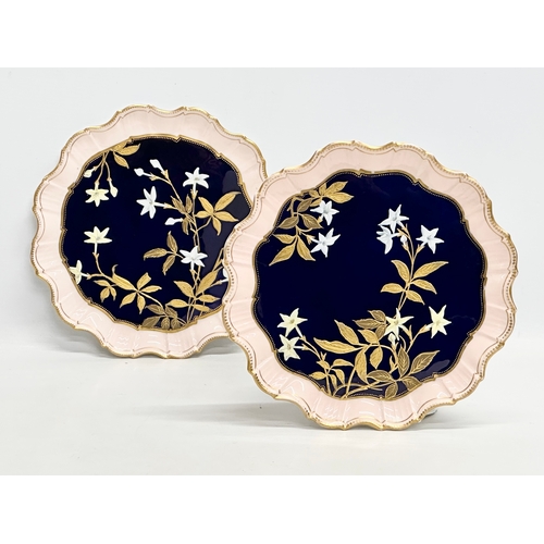 214 - A pair of fine quality Early 20th Century painted enamel cabinet plates with scalloped rims. Aynsley... 