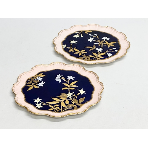 214 - A pair of fine quality Early 20th Century painted enamel cabinet plates with scalloped rims. Aynsley... 