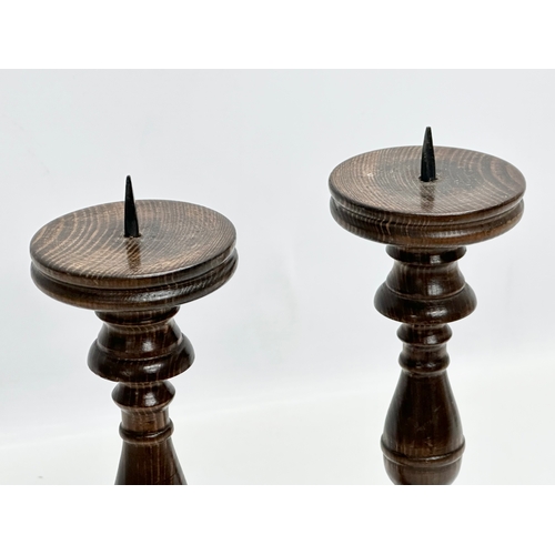 237 - A pair of vintage turned beech candlesticks. 29cm