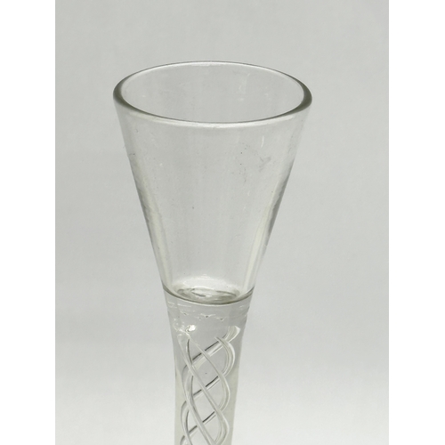 108A - A tall Late 19th Century Victorian twist stem wine glass. In the Georgian style. 22cm.