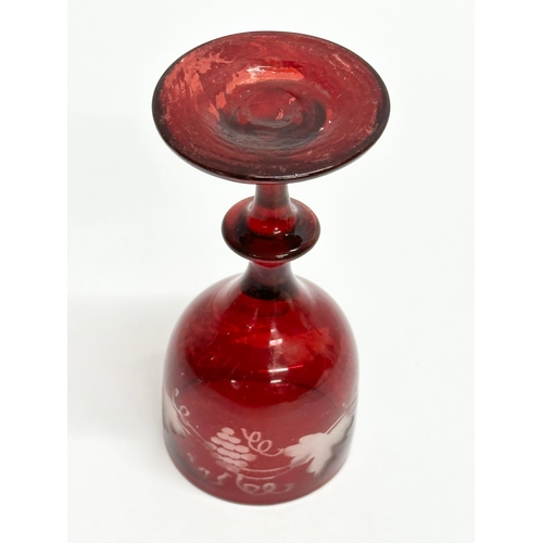 108B - An Early 19th Century Bohemian etched ruby port glass. Circa 1800-1810. 10cm