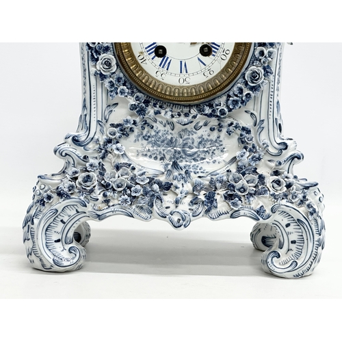 20 - Parkinson & Frodsham. A large Late 19th Century 3 piece flower encrusted porcelain clock set with 2 ... 