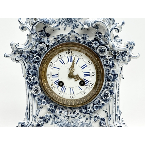 20 - Parkinson & Frodsham. A large Late 19th Century 3 piece flower encrusted porcelain clock set with 2 ... 