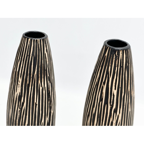 336 - A pair of 1970’s Mid Century pottery vases. 31cm.