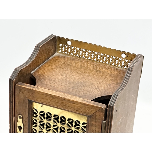 270 - A Late 19th Century Victorian oak smokers cabinet, with brass gallery and mesh door. 15x13x26cm.