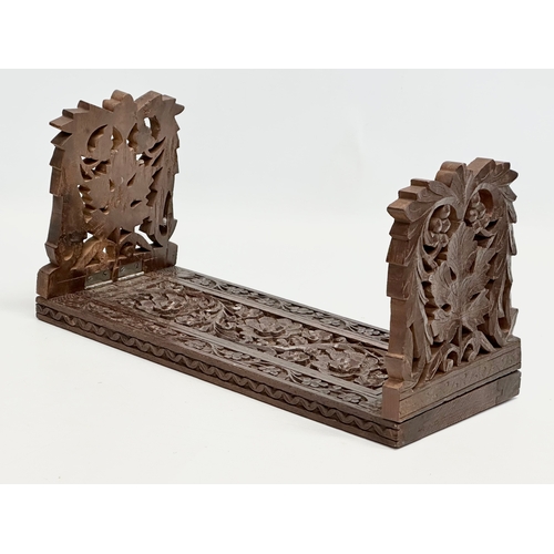 282 - A vintage carved extending bookstand. 33cm