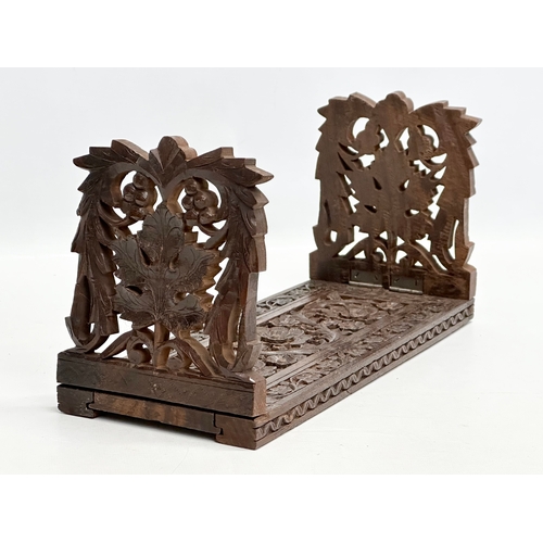 282 - A vintage carved extending bookstand. 33cm