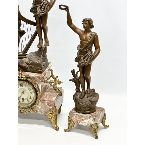 32 - A large Late 19th Century three piece French marble and bronzed spelter figural clock set, with gilt... 