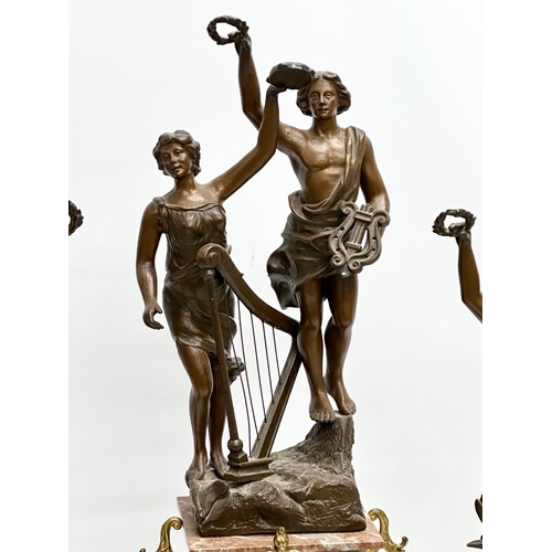 32 - A large Late 19th Century three piece French marble and bronzed spelter figural clock set, with gilt... 