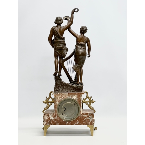 32 - A large Late 19th Century three piece French marble and bronzed spelter figural clock set, with gilt... 