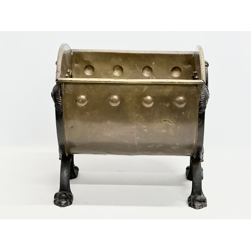 33 - A Late 19th Century Victorian brass coal bucket, with x-framed cast iron lion heads, paw feet and la... 