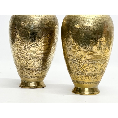 373 - A pair of Late 19th/Early 20th Century Egyptian Revival engraved brass baluster vases. 26cm