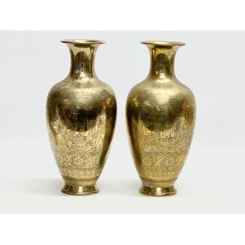 373 - A pair of Late 19th/Early 20th Century Egyptian Revival engraved brass baluster vases. 26cm