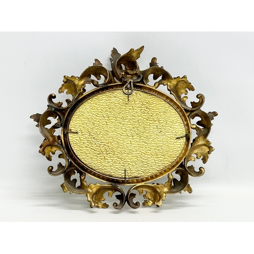 276 - A 19th Century Victorian brass framed mirror. Rococo style. 32x30cm