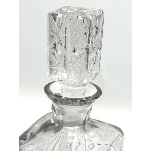 273 - A quality Mid 20th Century Bohemian star and pinwheel cut decanter. 28cm