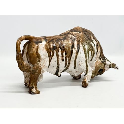 172 - Paula Humphris. A studio pottery glazed stoneware bull. Designed by Paula Humphris. 29cm