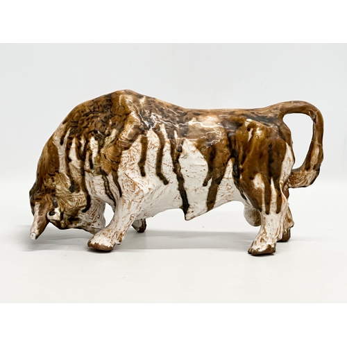 172 - Paula Humphris. A studio pottery glazed stoneware bull. Designed by Paula Humphris. 29cm