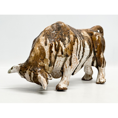 172 - Paula Humphris. A studio pottery glazed stoneware bull. Designed by Paula Humphris. 29cm