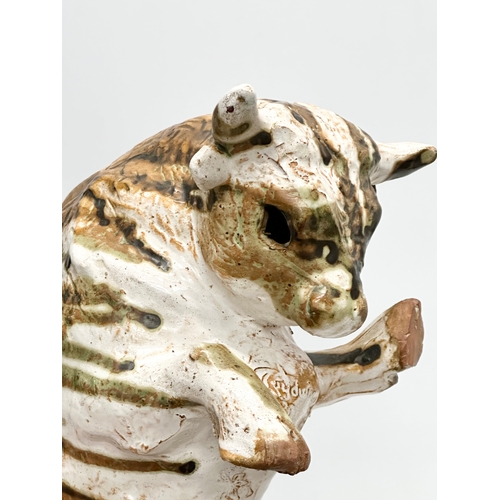 172 - Paula Humphris. A studio pottery glazed stoneware bull. Designed by Paula Humphris. 29cm