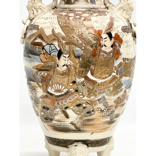 378 - A signed large Early 20th Century Japanese Samurai baluster vase, raised on 3 feet. Satsuma. 18x32cm