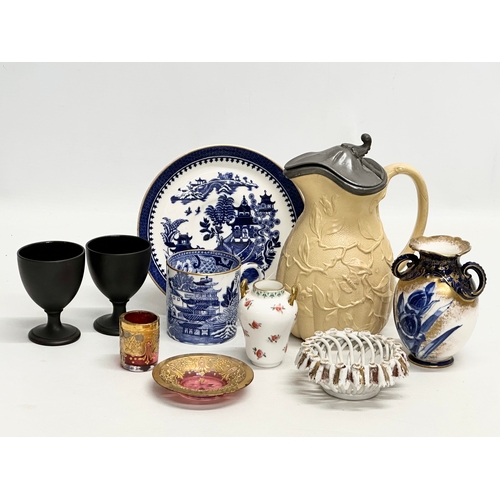 392 - A collection of pottery and glass. A Moser Glass gilt cranberry liqueur glass and saucer, Wedgwood c... 