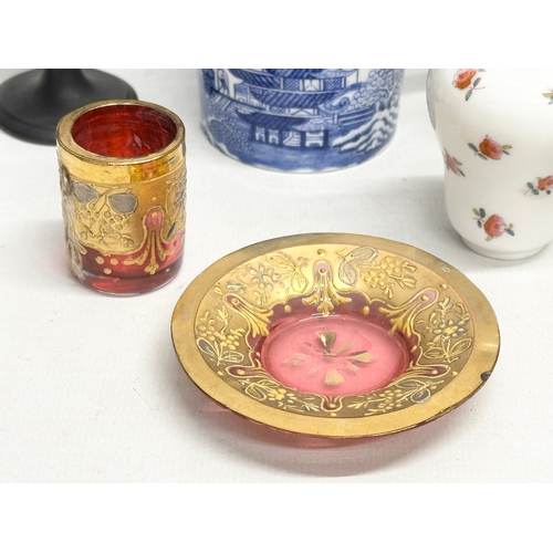 392 - A collection of pottery and glass. A Moser Glass gilt cranberry liqueur glass and saucer, Wedgwood c... 