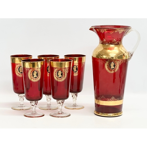 199 - A Venetian Murano 6 piece gilt and Ruby glass drinks set. 5 glasses 18.5cm. Pitcher jug 29.5cm. Mid ... 