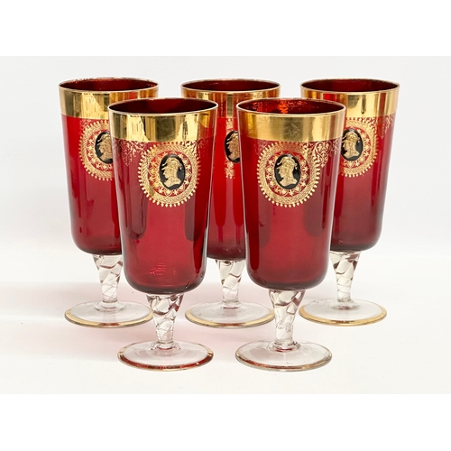 199 - A Venetian Murano 6 piece gilt and Ruby glass drinks set. 5 glasses 18.5cm. Pitcher jug 29.5cm. Mid ... 