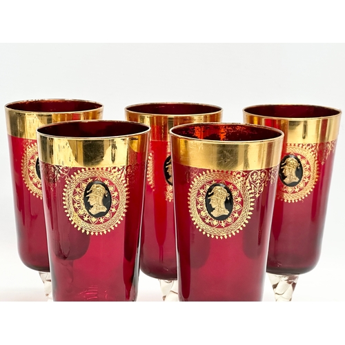 199 - A Venetian Murano 6 piece gilt and Ruby glass drinks set. 5 glasses 18.5cm. Pitcher jug 29.5cm. Mid ... 