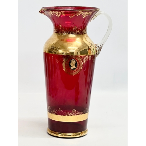 199 - A Venetian Murano 6 piece gilt and Ruby glass drinks set. 5 glasses 18.5cm. Pitcher jug 29.5cm. Mid ... 